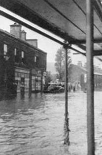 1954 Flooding in Street outside branch MBM-Au54P34.jpg