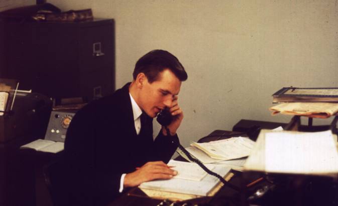 1962 Alan Prime at Dealing desk AP-MBA.jpg